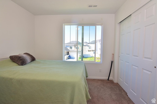2292 N Elderberry Dr W, Saratoga Springs, UT 84045 - carpeted bedroom with a closet, visible vents, and baseboards