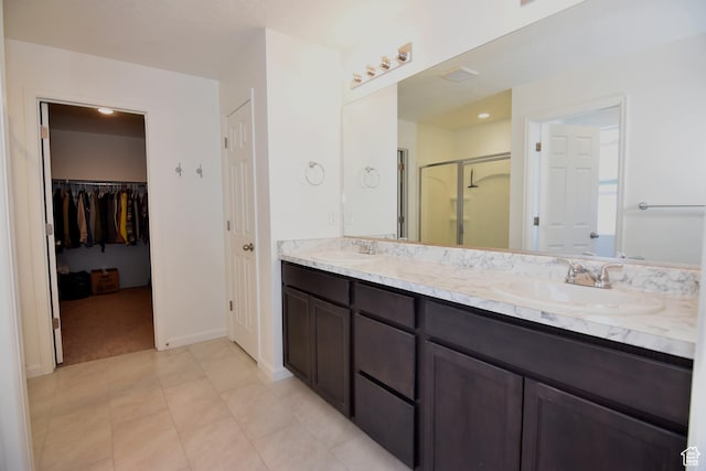 2292 N Elderberry Dr W, Saratoga Springs, UT 84045 - bathroom with double vanity, a stall shower, tile patterned flooring, and a sink