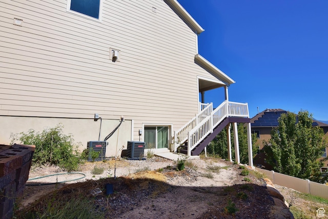 2292 N Elderberry Dr W, Saratoga Springs, UT 84045 - view of side of property featuring cooling unit, fence, and stairs