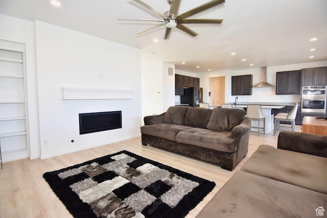 2292 N Elderberry Dr W, Saratoga Springs, UT 84045 - living area featuring recessed lighting, visible vents, a fireplace, and light wood finished floors