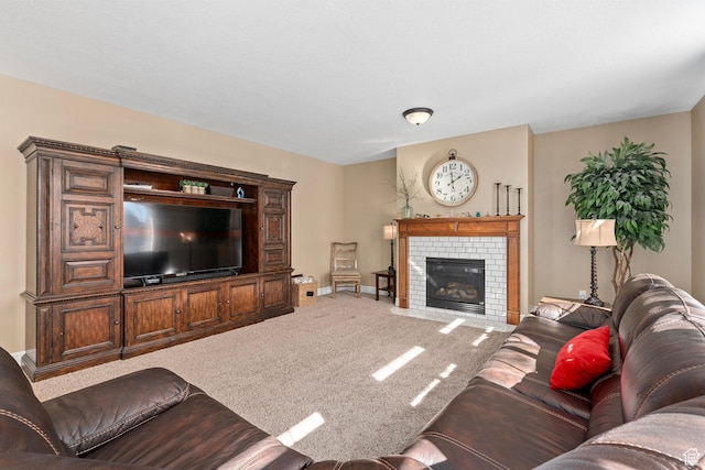 living room with carpet, baseboards, and a tiled fireplace