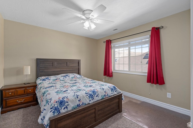 carpeted bedroom with baseboards and a ceiling fan