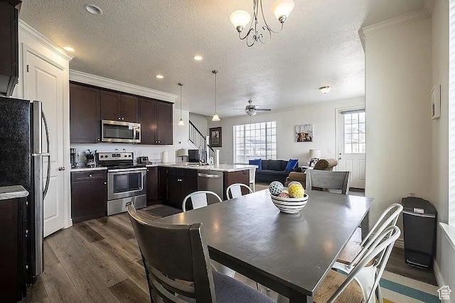 1042 W 500 S, Provo, UT 84601 - dining room with dark wood-style floors, ornamental molding, a textured ceiling, and ceiling fan with notable chandelier