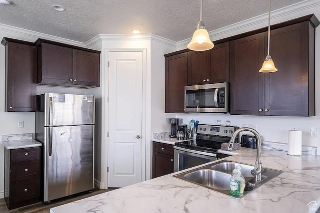 1042 W 500 S, Provo, UT 84601 - kitchen featuring dark brown cabinetry, light stone counters, decorative light fixtures, stainless steel appliances, and a sink