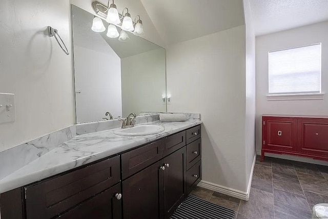 1042 W 500 S, Provo, UT 84601 - bathroom with vaulted ceiling, vanity, baseboards, and an inviting chandelier