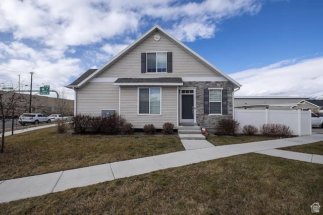 1042 W 500 S, Provo, UT 84601 - view of front of property with stone siding, fence, and a front lawn