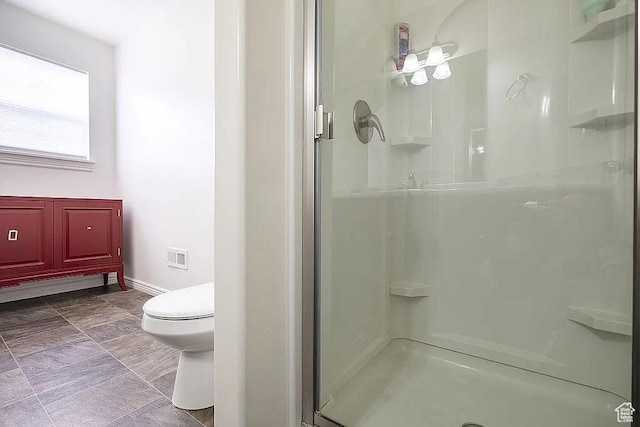 1042 W 500 S, Provo, UT 84601 - full bathroom featuring a shower stall, toilet, and baseboards