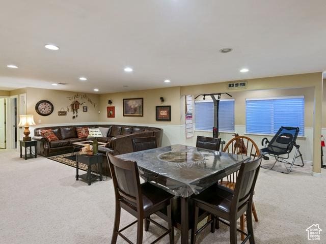 dining space featuring recessed lighting, light colored carpet, and visible vents