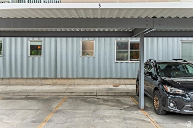 view of side of home with covered parking