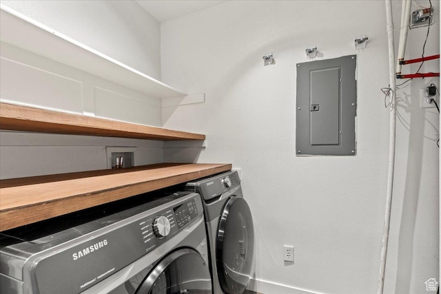 washroom featuring laundry area, electric panel, and independent washer and dryer