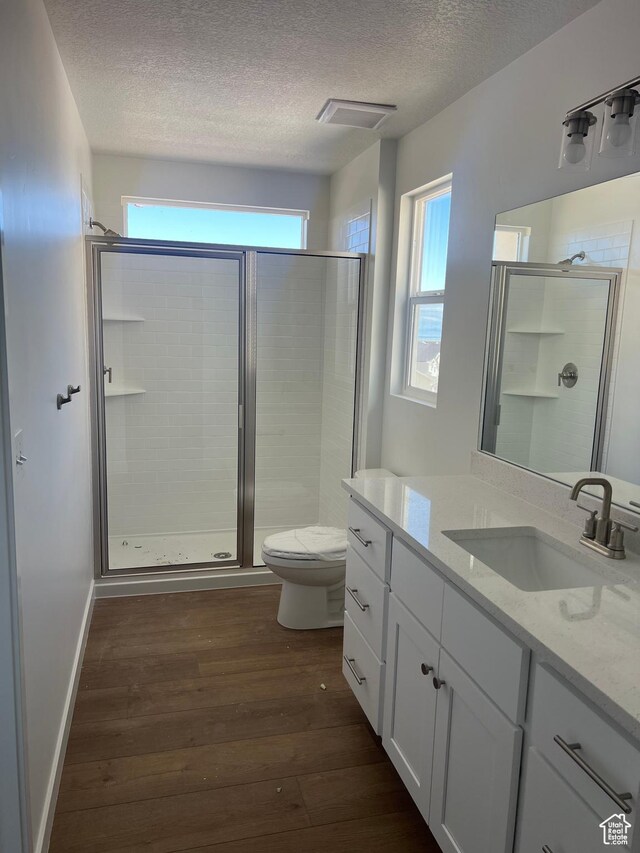 492 W Quartz Rd Unit 8019, Tooele, UT 84074 - full bathroom with a textured ceiling, a healthy amount of sunlight, and a shower stall