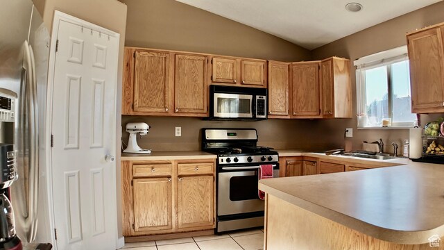 3320 S 1350 W, Perry, UT 84302 - kitchen featuring stainless steel appliances, a sink, lofted ceiling, light countertops, and a peninsula