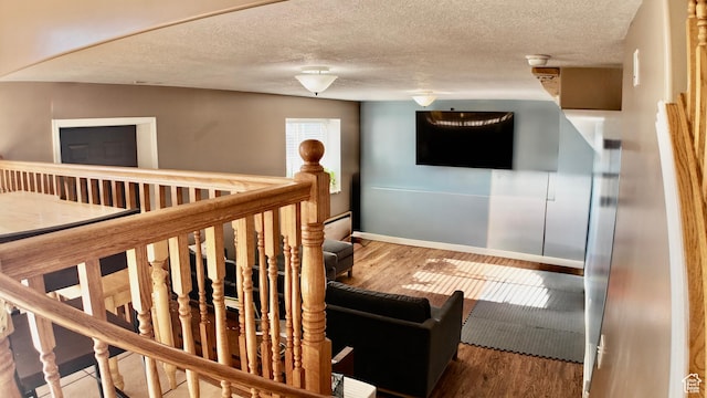 3320 S 1350 W, Perry, UT 84302 - stairs with wood finished floors, a textured ceiling, baseboards, and a baseboard heating unit