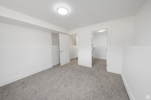 524 N 200 W, Tooele, UT 84074 - unfurnished bedroom featuring carpet floors, a spacious closet, and a closet