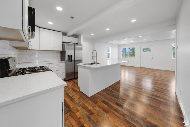 524 N 200 W, Tooele, UT 84074 - kitchen with stainless steel refrigerator with ice dispenser, gas range oven, dark wood-type flooring, decorative backsplash, and recessed lighting