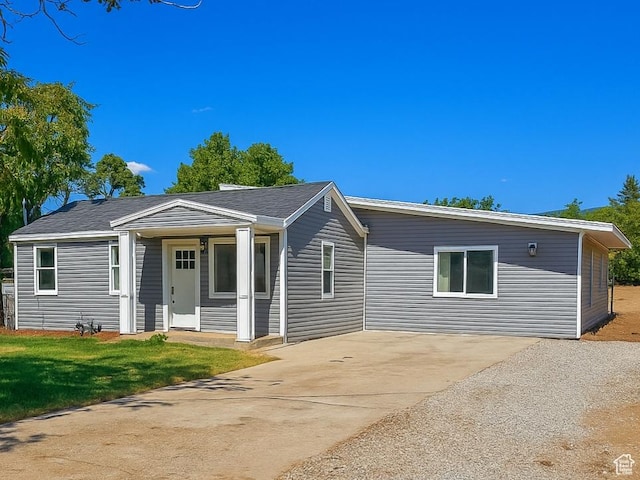 524 N 200 W, Tooele, UT 84074 - view of front of property with concrete driveway and a front lawn