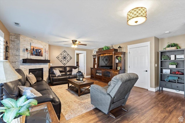 1004 W 4050 S, Riverdale, UT 84405 - living area with visible vents, a fireplace, baseboards, and wood finished floors