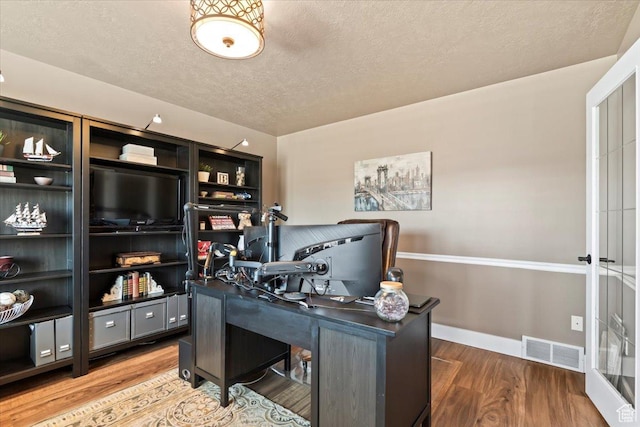 1004 W 4050 S, Riverdale, UT 84405 - home office with a textured ceiling, wood finished floors, visible vents, and baseboards