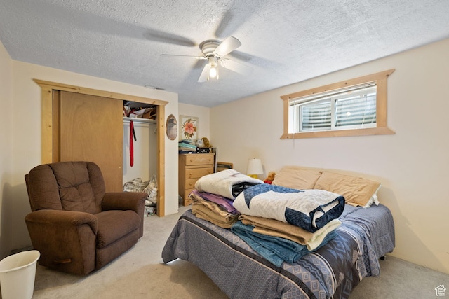 879 E Main St, Mount Pleasant, UT 84647 - bedroom with light carpet, a textured ceiling, a ceiling fan, and a closet