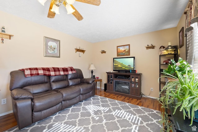 879 E Main St, Mount Pleasant, UT 84647 - living area featuring ceiling fan, a textured ceiling, wood finished floors, and baseboards