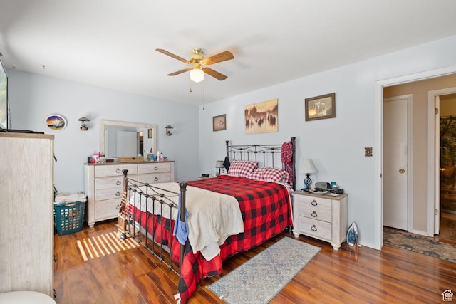 879 E Main St, Mount Pleasant, UT 84647 - bedroom with a ceiling fan, baseboards, and wood finished floors