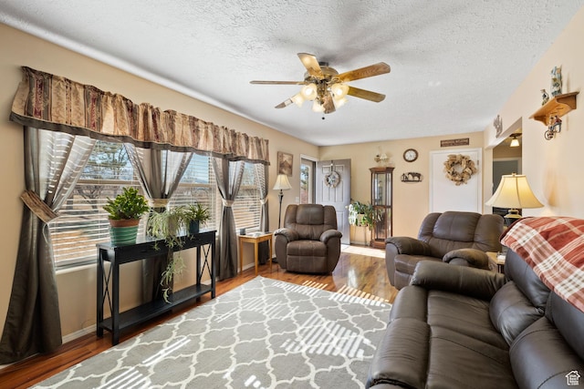 879 E Main St, Mount Pleasant, UT 84647 - living area featuring a textured ceiling, a ceiling fan, and wood finished floors