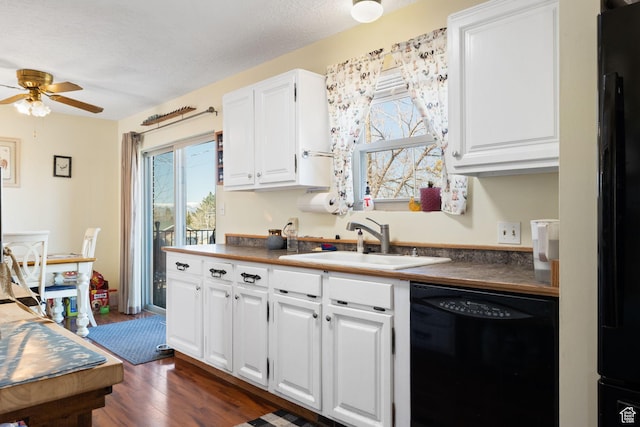 879 E Main St, Mount Pleasant, UT 84647 - kitchen featuring dark wood-style flooring, white cabinetry, a sink, ceiling fan, and black appliances
