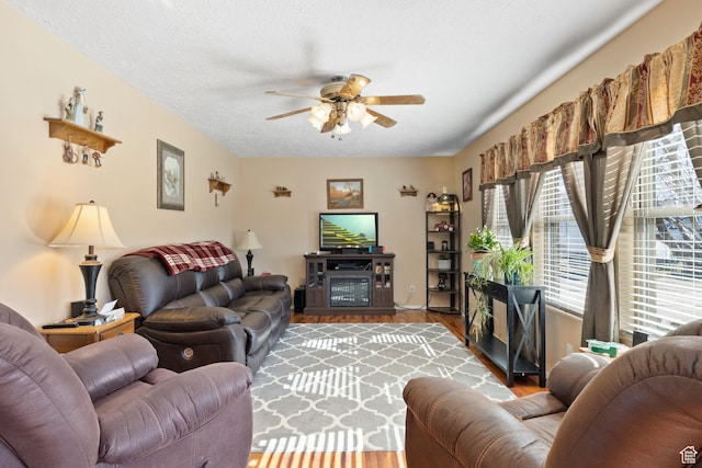 879 E Main St, Mount Pleasant, UT 84647 - living area with ceiling fan, a textured ceiling, and wood finished floors