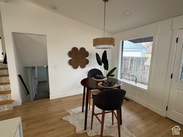 1379 E Sumac Way, Murray, UT 84121 - dining room with lofted ceiling, light wood-style floors, baseboards, and stairway