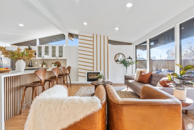 1379 E Sumac Way, Murray, UT 84121 - living room featuring light wood finished floors, recessed lighting, and a fireplace