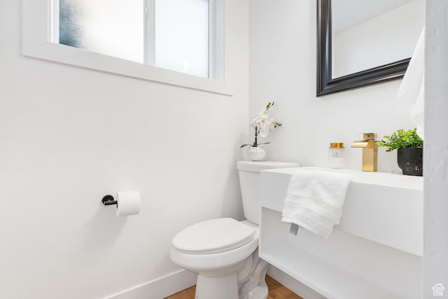 1379 E Sumac Way, Murray, UT 84121 - bathroom featuring toilet, wood finished floors, and plenty of natural light