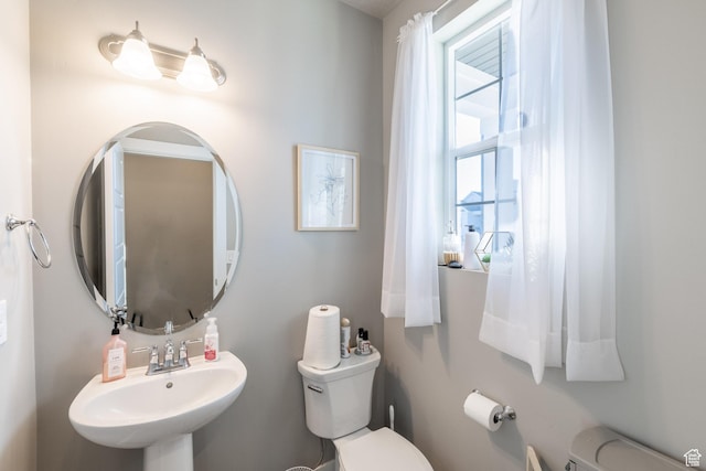 bathroom with a sink and toilet