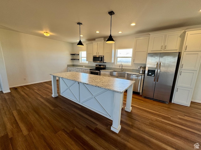 kitchen with a sink, white cabinetry, appliances with stainless steel finishes, dark wood-style floors, and open shelves