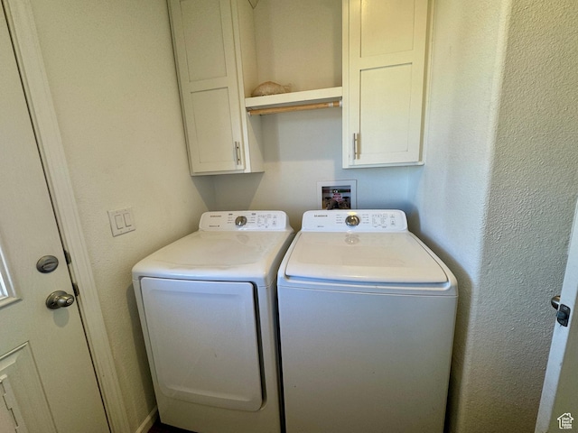 laundry area with cabinet space and washer and dryer