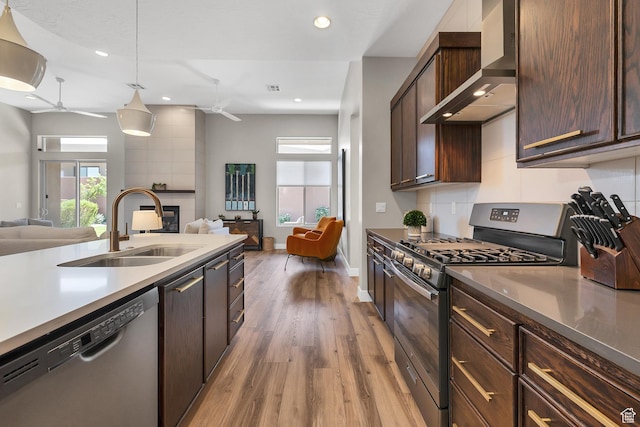 5417 W Copper Cliffs Way, Hurricane, UT 84737 - kitchen featuring stainless steel appliances, ceiling fan, open floor plan, and wall chimney range hood