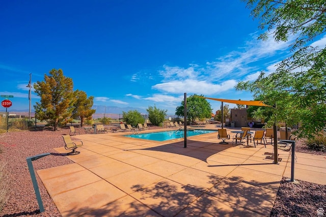 5417 W Copper Cliffs Way, Hurricane, UT 84737 - community pool featuring a patio, fence, and an outdoor structure