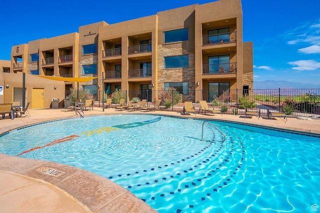 5417 W Copper Cliffs Way, Hurricane, UT 84737 - community pool featuring a patio and fence