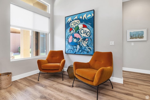 5417 W Copper Cliffs Way, Hurricane, UT 84737 - sitting room with wood finished floors and baseboards