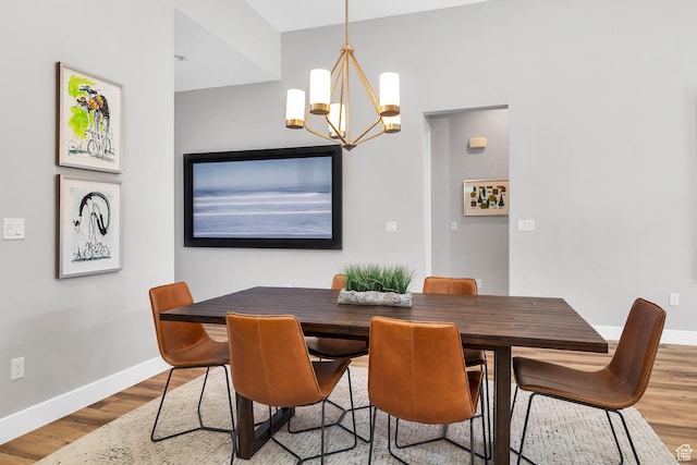5417 W Copper Cliffs Way, Hurricane, UT 84737 - dining space with wood finished floors, a chandelier, and baseboards