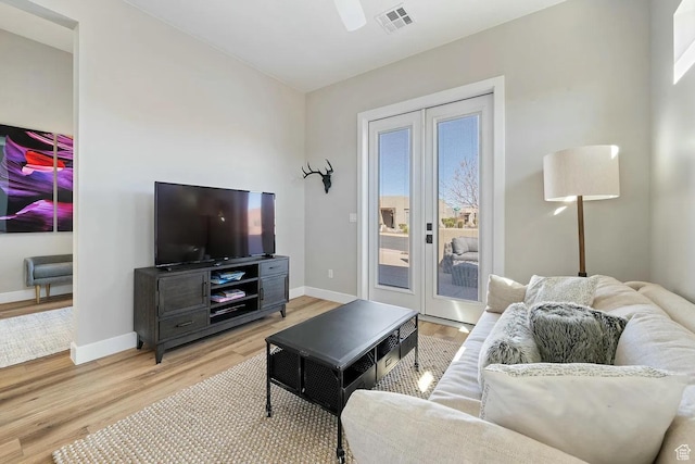 5417 W Copper Cliffs Way, Hurricane, UT 84737 - living area with baseboards, visible vents, ceiling fan, and light wood finished floors