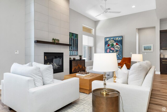 5417 W Copper Cliffs Way, Hurricane, UT 84737 - living room featuring a tile fireplace, a ceiling fan, recessed lighting, and wood finished floors