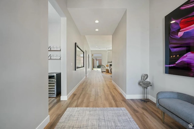 5417 W Copper Cliffs Way, Hurricane, UT 84737 - corridor with baseboards, beverage cooler, wood finished floors, and recessed lighting