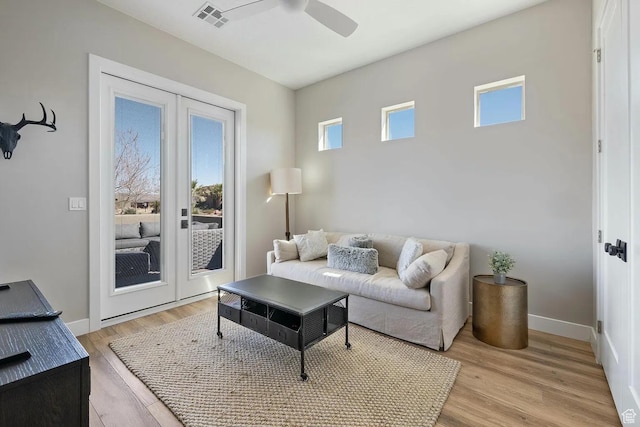 5417 W Copper Cliffs Way, Hurricane, UT 84737 - living area featuring light wood finished floors, baseboards, visible vents, a ceiling fan, and french doors