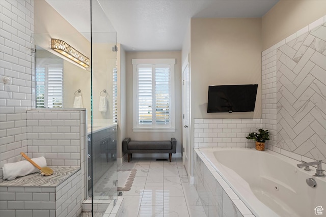 bathroom featuring marble finish floor, an enclosed shower, and a bath
