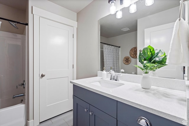 full bath featuring shower / bath combo with shower curtain and vanity