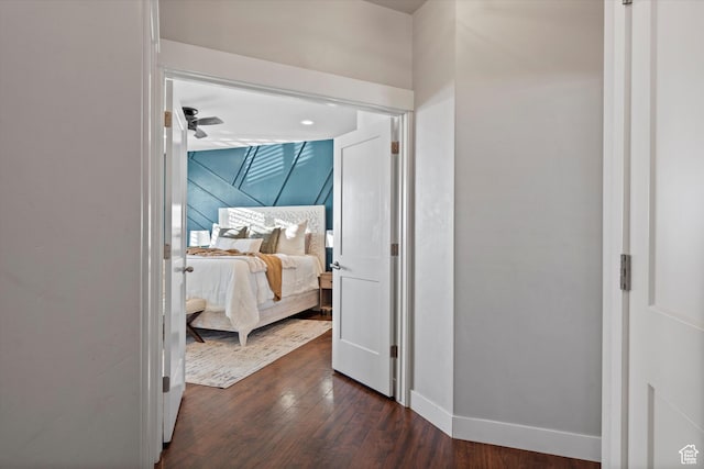 interior space with dark wood-type flooring and baseboards