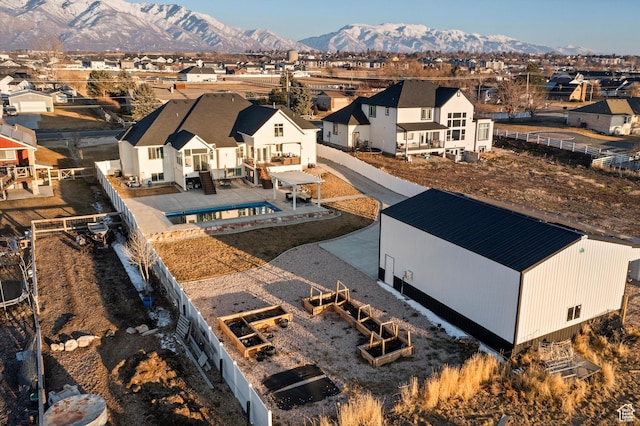 drone / aerial view featuring a mountain view and a residential view