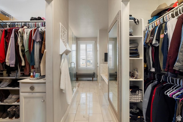 spacious closet with light tile patterned flooring