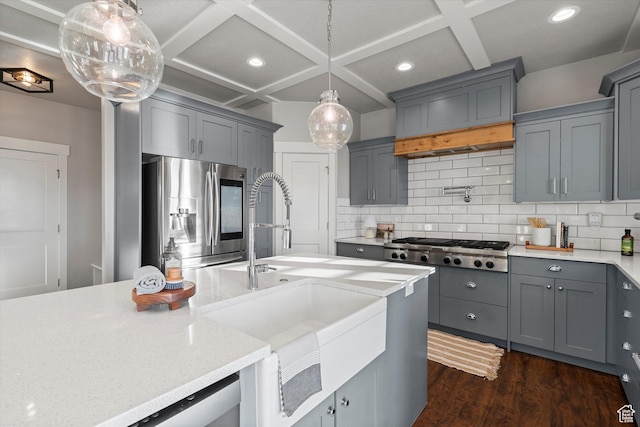 kitchen with coffered ceiling, gray cabinets, and stainless steel appliances