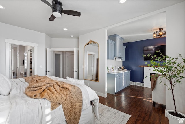 bedroom featuring a ceiling fan, baseboards, dark wood-style flooring, and recessed lighting